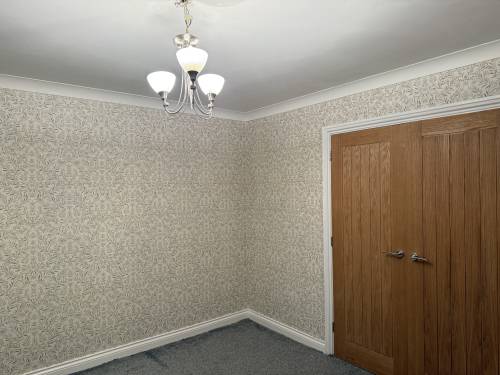 Wallpapered living room corner